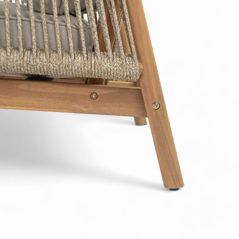 Noble House Sumbawa outdoor club arm chair with woven rattan-style frame and plush cushion, ideal for patio or garden seating.