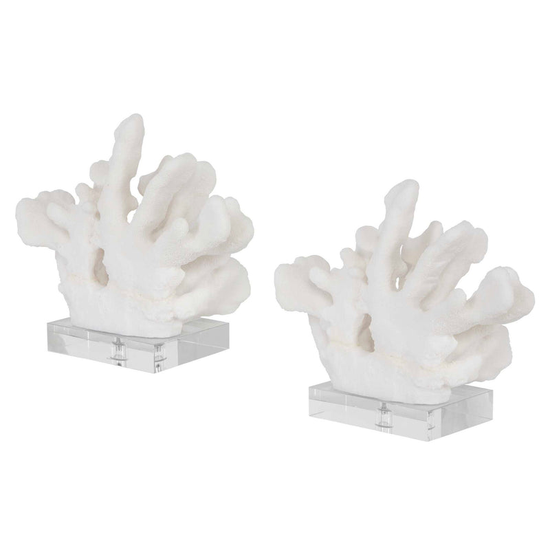 Pair of white Uttermost Charbel bookends, modern design with sleek finish, holding books on a bookshelf.