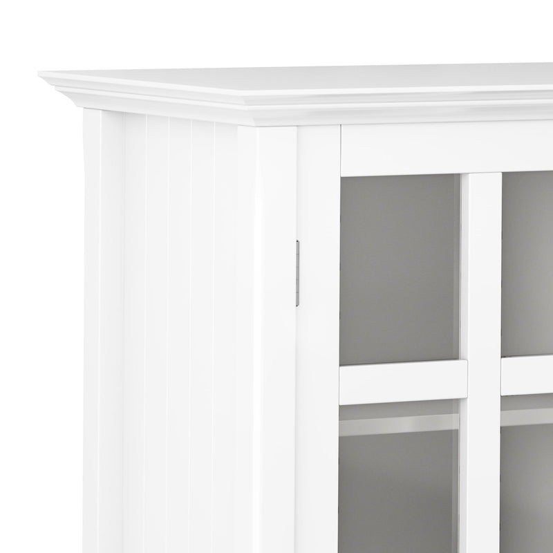 Handcrafted Acadian medium storage cabinet by Simpli-Home featuring a rustic wooden accent cabinet with doors and storage shelves.