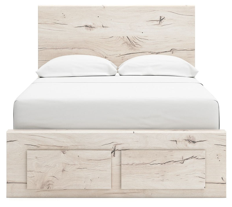 Signature Design by Ashley Lawroy storage bed with panel headboard and built-in under-bed drawers for extra bedroom storage.