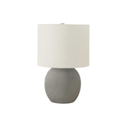 Contemporary gray and cream concrete table lamp by 8th Street, showcasing a modern design with a sleek, minimalist style.
