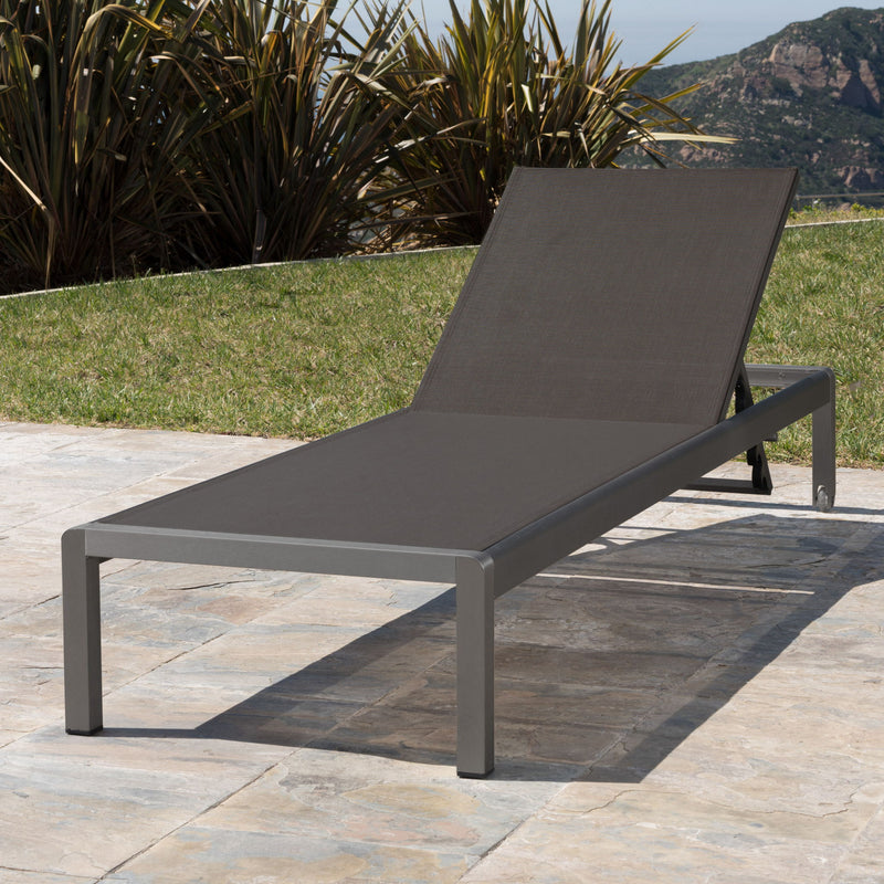 Noble House outdoor patio chaise lounge with five adjustable reclining positions, featuring a sleek, cushioned design for outdoor relaxation.