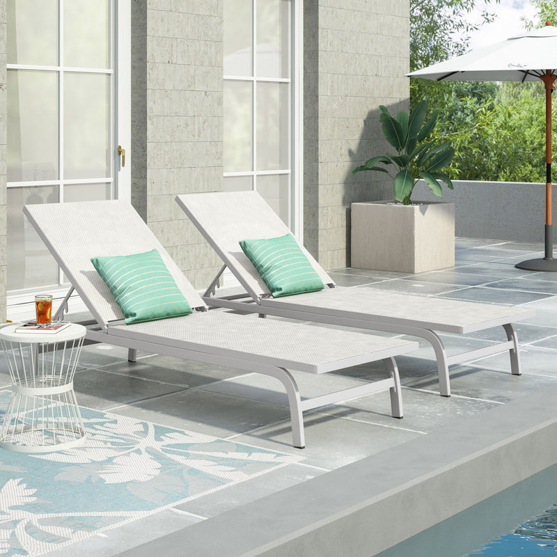 Noble House Finn outdoor chaise lounge with modern design, featuring plush cushions and a sleek frame for outdoor relaxation.