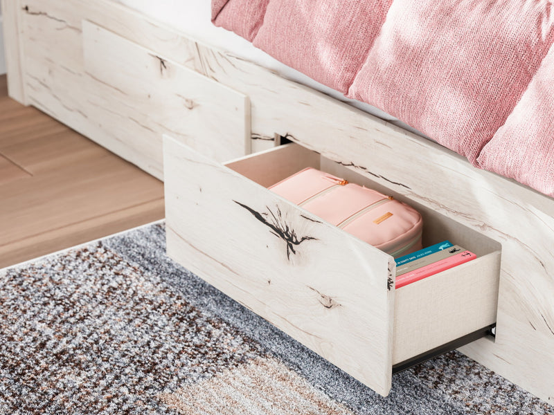 Signature Design by Ashley Lawroy storage bed with panel headboard and built-in under-bed storage drawers.