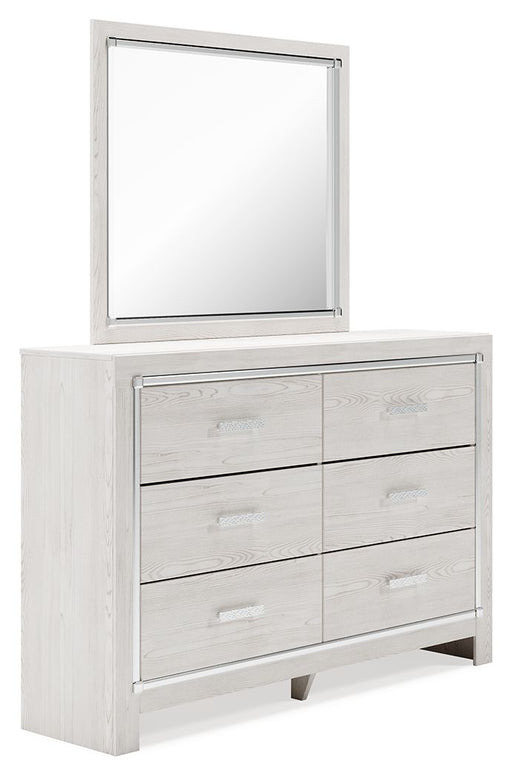 Signature Design by Ashley Altyra 7-piece bedroom set with bookcase, dresser, mirror, nightstands, and bed frame in a modern bedroom setting.