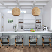 Uttermost seagrass 1-light dome pendant in light brown hangs from ceiling, showcasing natural woven texture and pendant lighting style.
