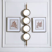 Uttermost wall mirror with a stylish button design, featuring a round frame and modern decorative details.