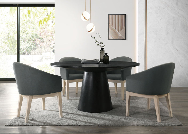 Lilola Home Jasper 59-inch round dining table with four matching chairs in a 5-piece dining room set.