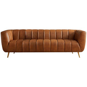 Ashcroft Furniture Ava stationary sofa with gold and tan upholstery, featuring plush cushions and a modern design.