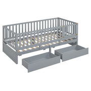 DreamHaus storage daybed with fence guardrails, two drawers, and split design as a floor bed and daybed, shown with neutral bedding.