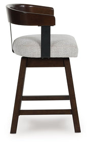 Haddigan - Upholstered Swivel Barstool (Set of 2) - Dark Brown - R&R Furniture Gallery (Fountain Valley, CA)