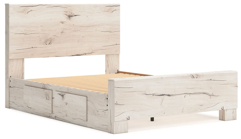 Signature Design by Ashley Lawroy storage bed with panel headboard and built-in storage drawers in a modern bedroom setting.
