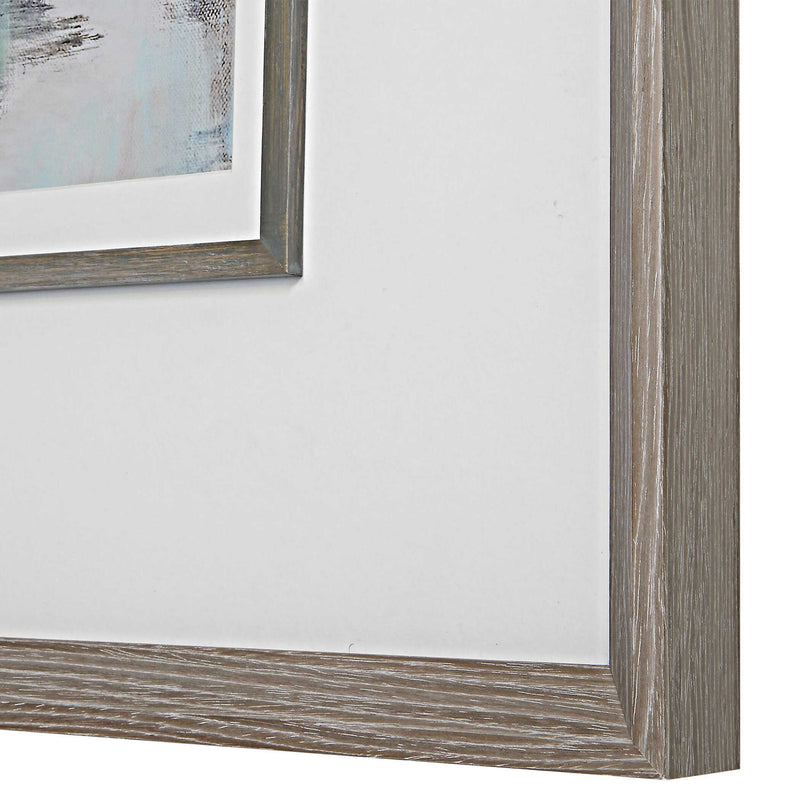 Watercolor framed print titled Morning Lake in blue by Uttermost, featuring a serene lakeside scene with a natural wooden frame.