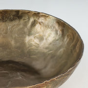 Set of three TOV Furniture Shah hammered iron catchall round bowls in antique brass, serving bowls for storage and display.