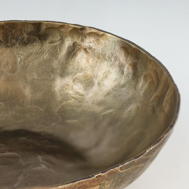 Set of three TOV Furniture Shah hammered iron catchall round bowls in antique brass, serving bowls for storage and display.