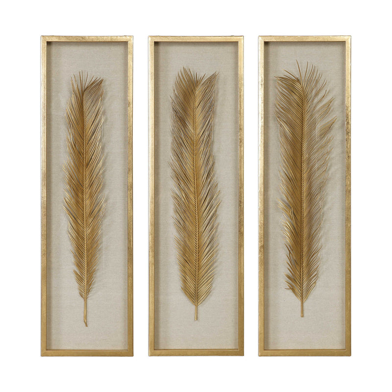 Set of three Uttermost Palma Leaf Shadow Box wall decor in gold with intricate leaf design on textured backgrounds.