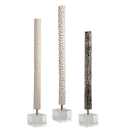 Set of three pearl silver cylindrical sculptures by Uttermost, modern decorative figurines for contemporary home decor.