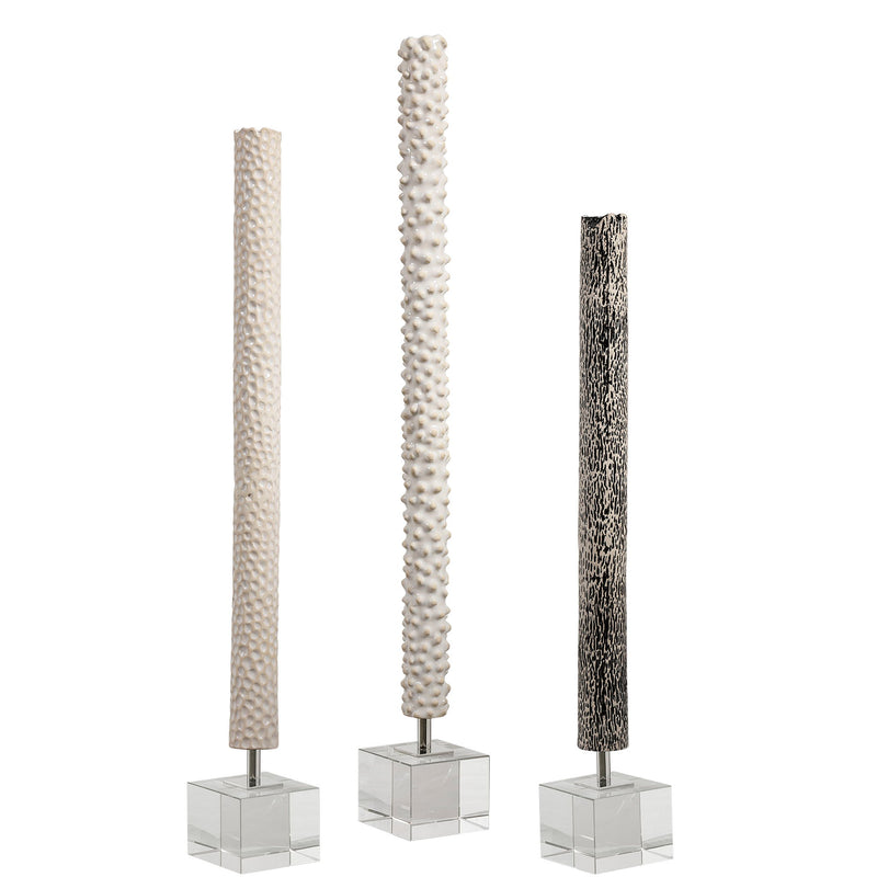 Set of three pearl silver cylindrical sculptures by Uttermost, modern decorative figurines for contemporary home decor.