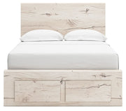 Signature Design by Ashley Lawroy panel storage bed with built-in drawers and modern wood finish in a cozy bedroom setting.