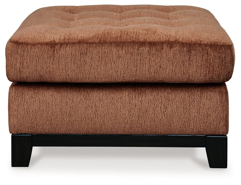 Ashley® Laylabrook oversized accent ottoman in plush spice fabric with dark wood trim, square shape with soft cushioning.