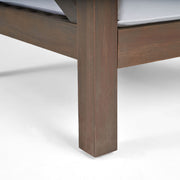 Noble House Brava mid-century modern arm chair with water-resistant cushions, featuring wooden legs and plush seating.