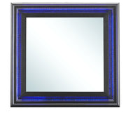 Glossy metallic black mirror from Glory Furniture with sleek rectangular frame, hanging on a modern wall.