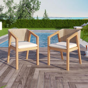 Set of two Noble House patio dining chairs in light teak wood with slatted backs and armrests, ideal for outdoor dining spaces.