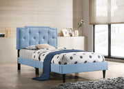 Button tufted upholstered bed by Glory Furniture showing a cozy, stylish bed with plush fabric and tufted headboard in a bedroom setting.