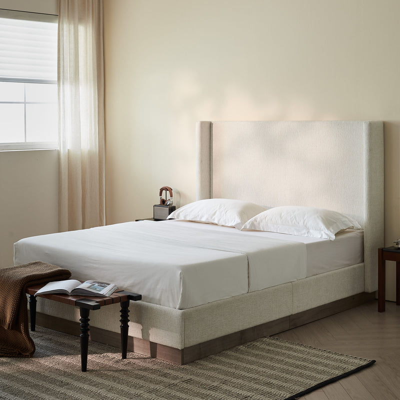 House & Home Furniture Hosford minimalist upholstered wingback bed with wood base platform, showcasing a modern, padded headboard and sturdy frame