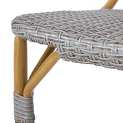 Set of two Noble House outdoor rattan and aluminum armless French bistro chairs in dark gray for patio or garden use.