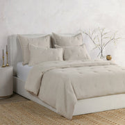 Classic Home Talia comforter set with a cozy, patterned design displayed on a bed in a bedroom setting.