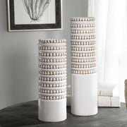 Set of two white Angelou vases by Uttermost, featuring elegant ceramic design perfect for decorative display.