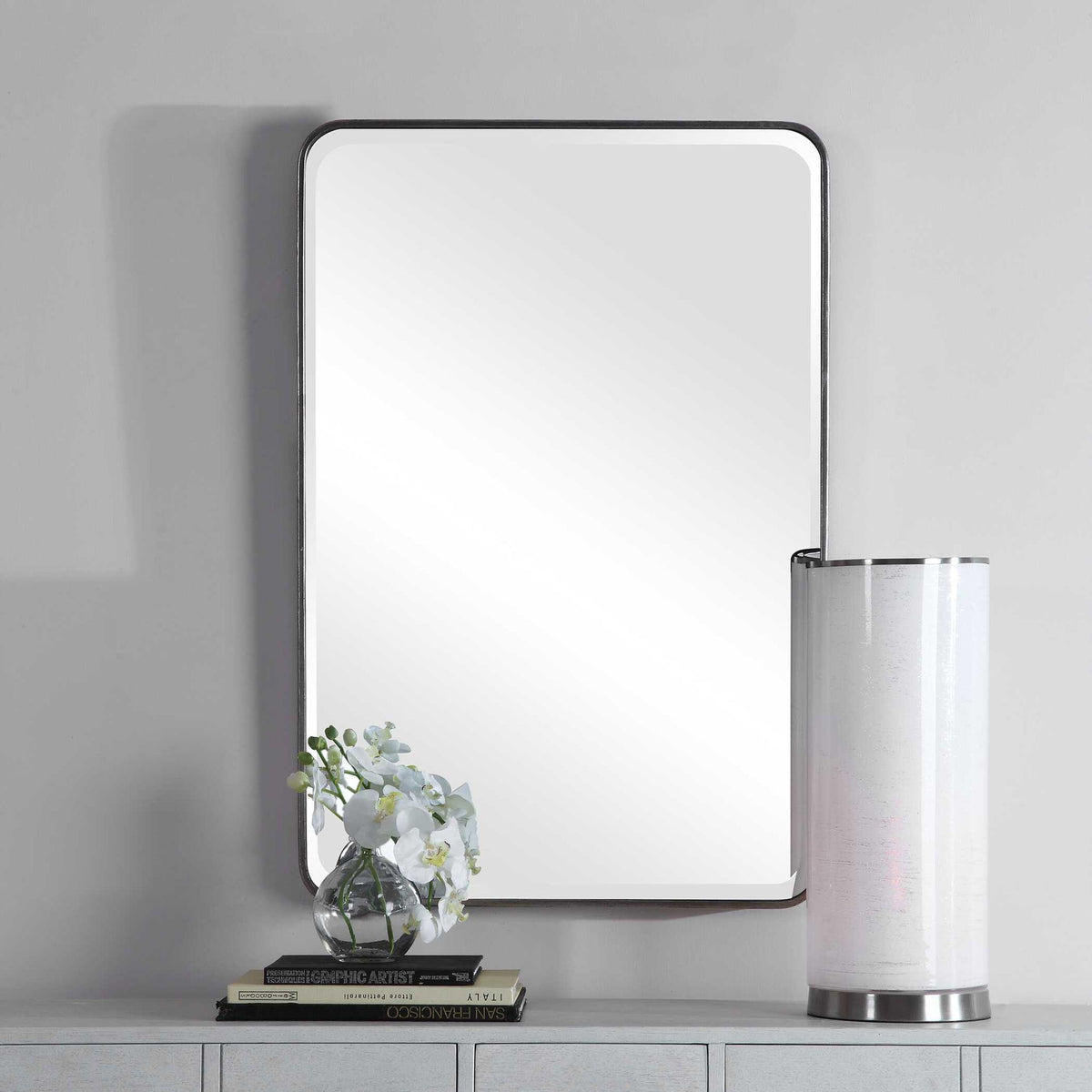Silver wall mirror by Uttermost with a sleek, modern frame, perfect for contemporary interior decor.