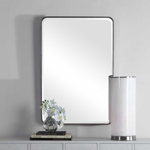 Silver wall mirror by Uttermost with a sleek, modern frame, perfect for contemporary interior decor.