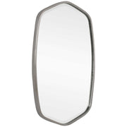 Uttermost Duronia iron wall mirror with a sleek frame, hanging on a modern living room wall.