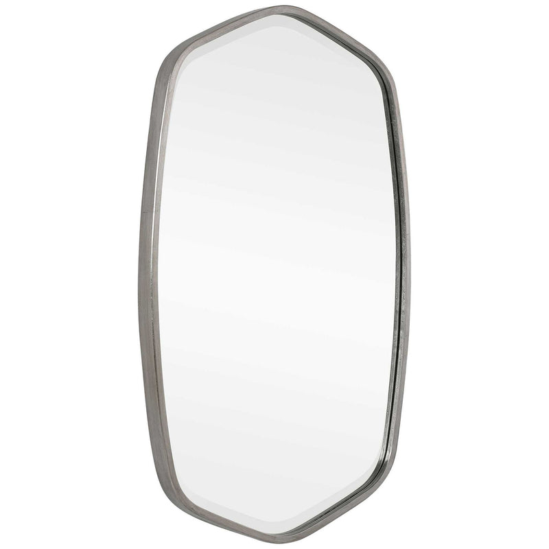 Uttermost Duronia iron wall mirror with a sleek frame, hanging on a modern living room wall.