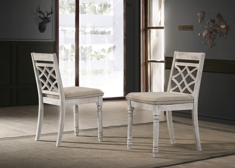 Set of two Lilola Home Havanna wide chairs with off-white cushions, featuring modern design and sturdy wooden legs.