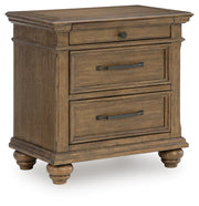 Medium brown Karallin three drawer accent nightstand by Signature Design Ashley with sleek wood finish and modern design.