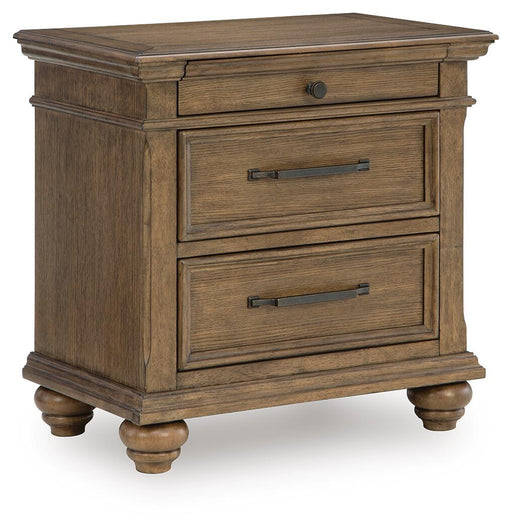 Medium brown Karallin three drawer accent nightstand by Signature Design Ashley with sleek wood finish and modern design.
