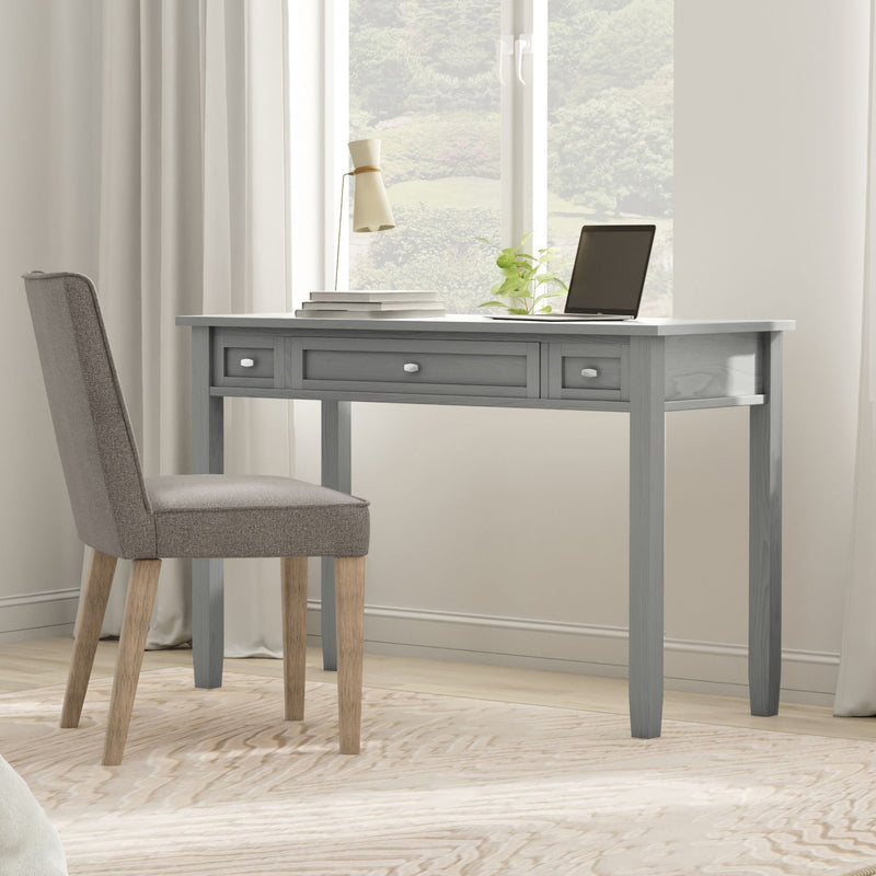 Handcrafted Warm Shaker desk by Simpli-Home, featuring a smooth wooden surface, clean lines, and a minimalist design for writing and work.