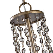 Valka 6-light crystal chandelier by Uttermost featuring light brown finish and elegant hanging crystal accents.