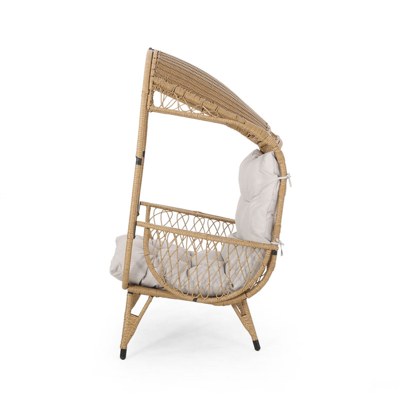Outdoor wicker standing basket chair with cushion by Noble House, featuring a cozy, stylish accent chair for outdoor relaxation.