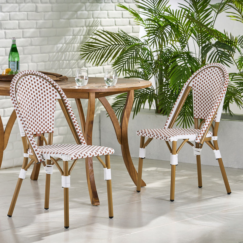 Set of four outdoor rattan and aluminum French bistro chairs by Noble House, featuring woven rattan seats and slender metal frames.