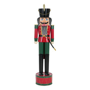 Noble House classic nutcracker holiday decor in green and red, featuring a detailed Christmas-themed wooden figure.