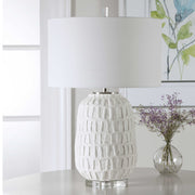 Uttermost Caelina textured white table lamp with a modern design, featuring a sleek base and fabric shade for stylish illumination.