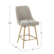 Upholstered gray and gold counter stool by Uttermost with a modern design and wooden legs, suitable for kitchen or bar area.