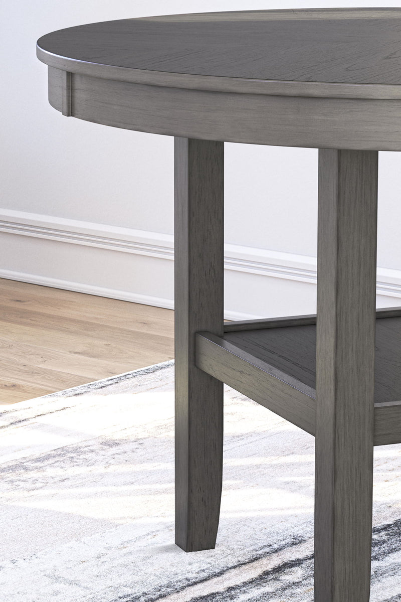 Gray Wrenning five-piece dining room table set by Signature Design by Ashley, showing the table and matching chairs in a dining room.