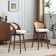 Pair of Noble House Como indoor wood barstools with round seats and sleek legs, set against a neutral background.