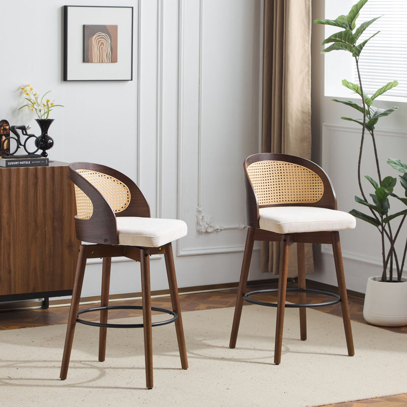Pair of Noble House Como indoor wood barstools with round seats and sleek legs, set against a neutral background.