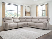 Benchcraft® Gravier reclining sectional sofa with plush cushions and modern design, shown in a living room setting.